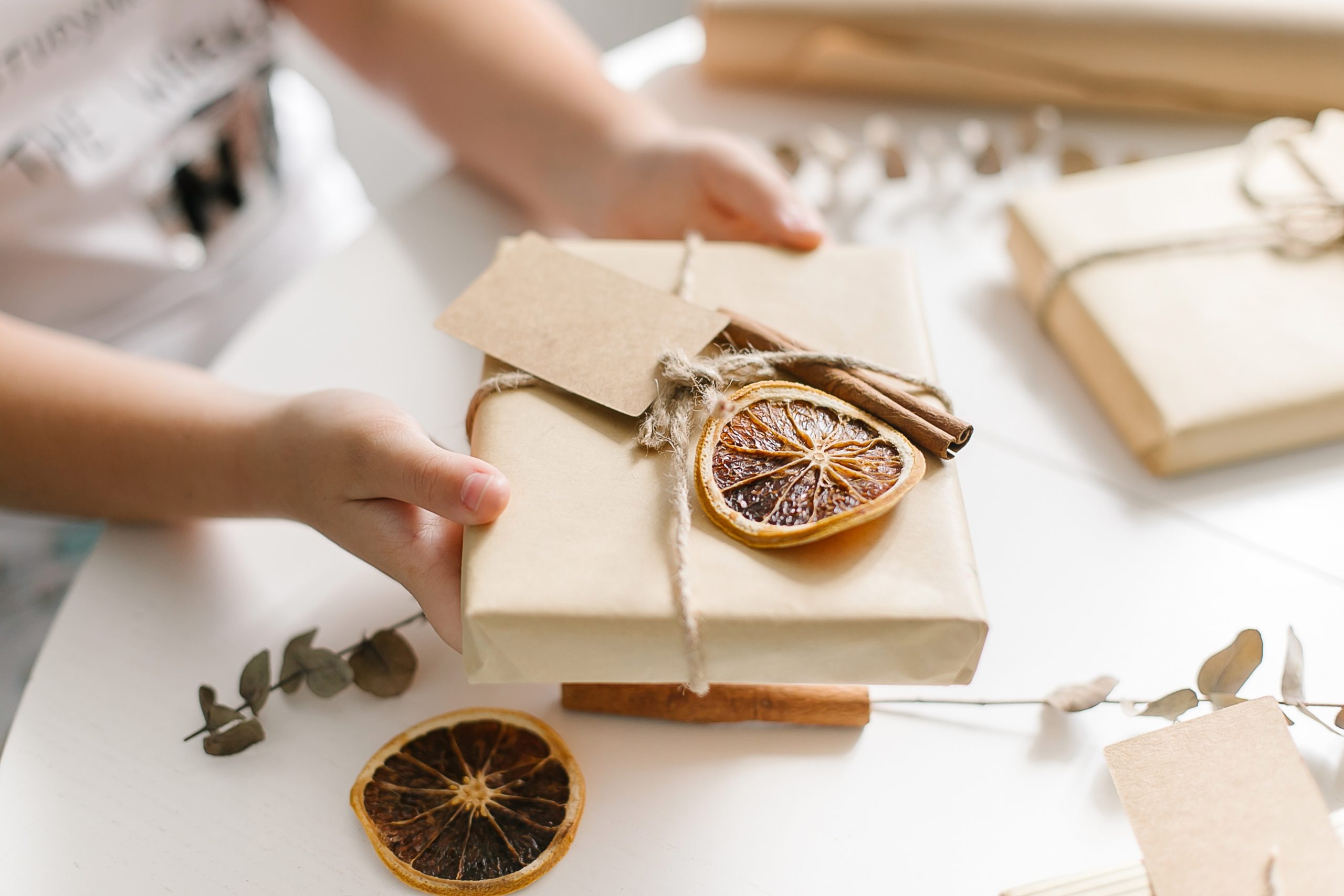 woman holding a gift present wrapping brown craft 2022 11 15 23 11 12 utc scaled